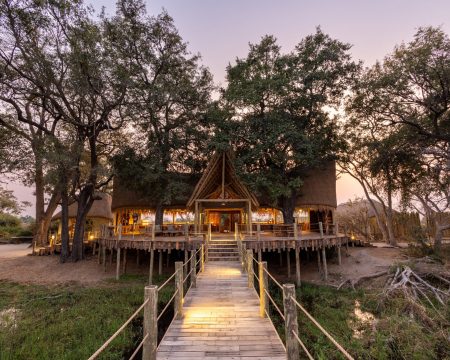 Built on a raised, wrap-around railway sleeper private deck using entirely recycled materials, Sitatunga Private Island can accommodate up to eight guests as part of Great Plains latest Okavango Delta water-based Réserve-Collection Safari Camp.

Sitatunga’s design tells the story of the Okavango, a camp surrounded by water referenced to a Robinson Crusoe experience, and one that has had indigenous fishermen in the region for over 200 years. Those fishermen designed and used fishing baskets and traps made from reeds in the shape of a funnel so Dereck Joubert took this reference and designed the rooms as tents hanging inside of giant bamboo fisherman baskets. The interiors as a result draw on a colour range that you can see by looking out at the Okavango, misty greens, and light-bleached woods.
